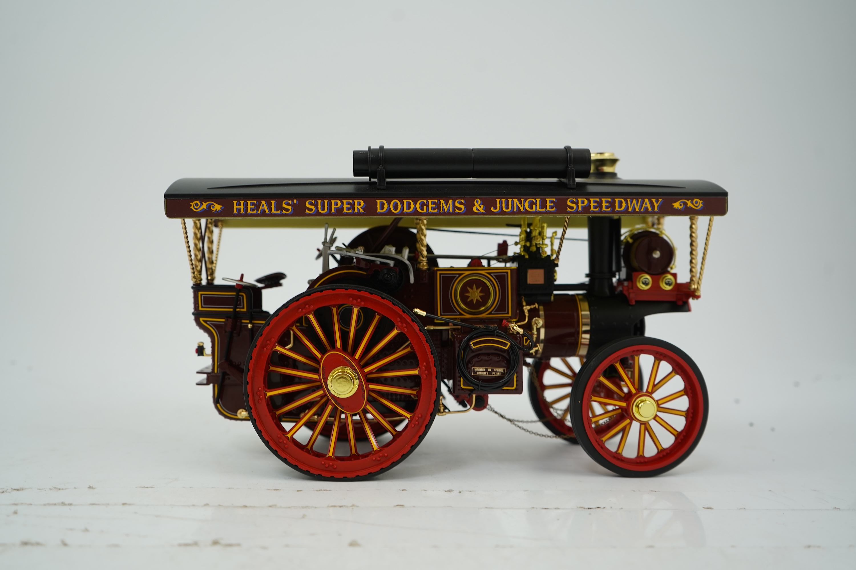 A Midsummer Models Ltd. 1:24 scale model of a Burrell Showman’s Engine, The White Rose of York, in ‘Alfred Payne - Amusement Caterers - Hull’ livery, missing the original card box, but with an oak and Perspex display cas
